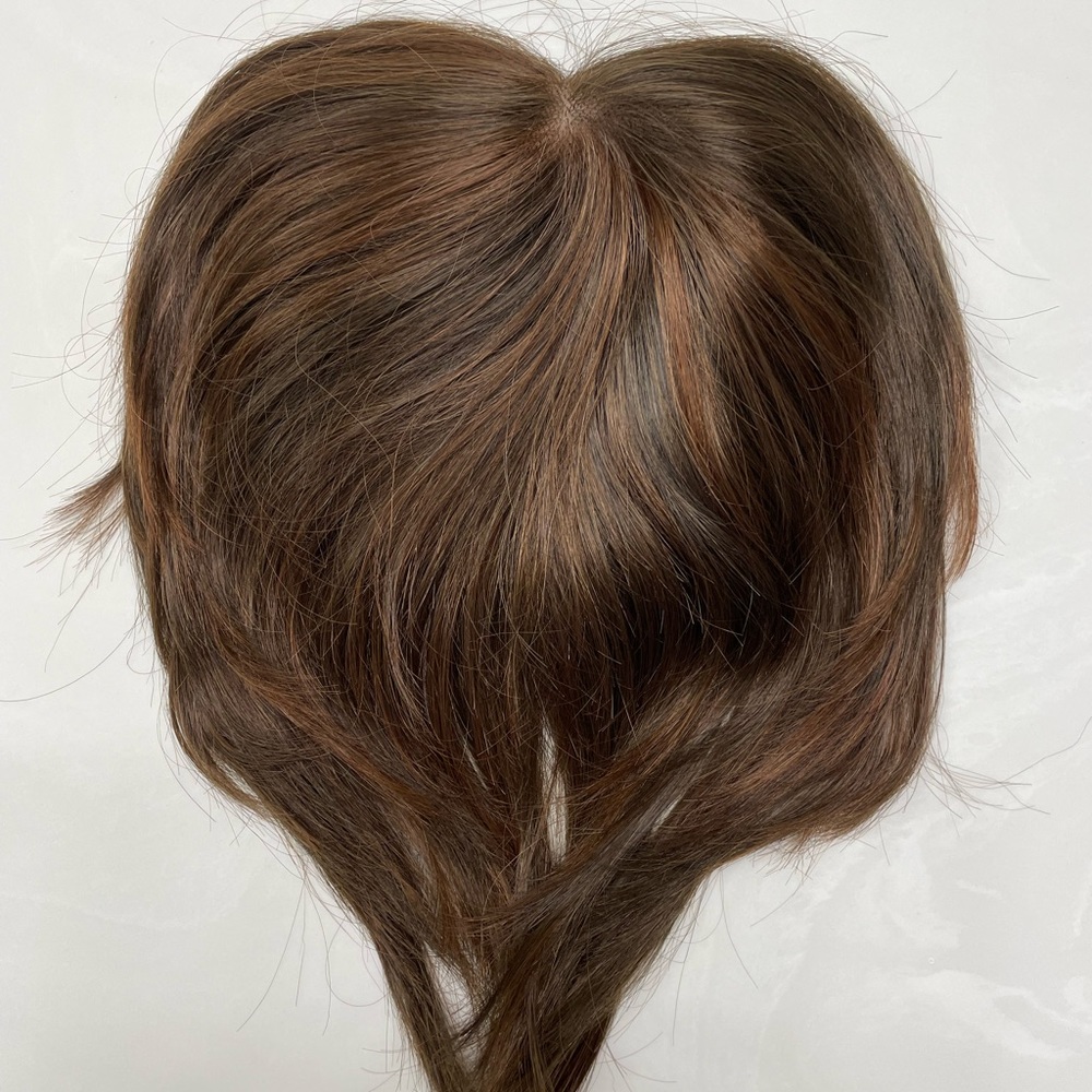 Jon R Essentially You topper that clips into existing hair, blending seamlessly.